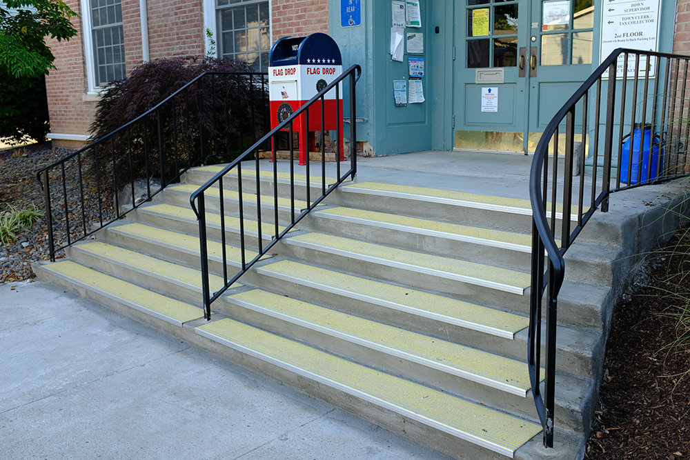 The Lloyd Town Hall now has new steps that are capped by skid-resistant metal covers. The glass sides and wood doors at the entryway need work but that will be done in the future.
